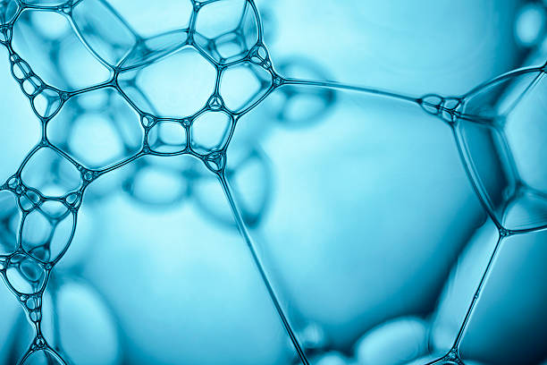 Blue Soap Bubbles 4 - Water Abstract Macro Foam Background Macro photography of soap bubbles. Blue backlight. foam material photos stock pictures, royalty-free photos & images