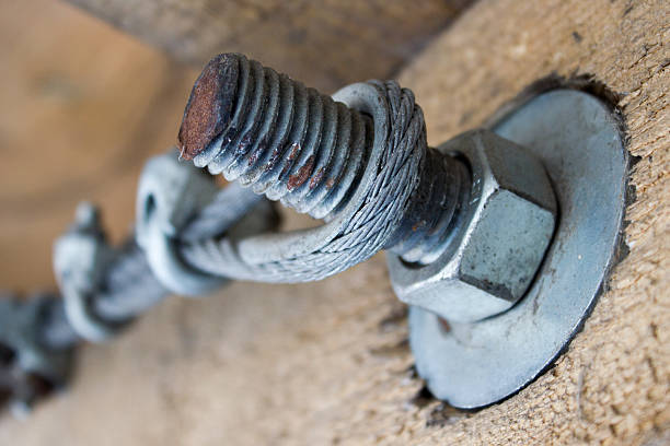 istock Metal anchoring wooden beams, bolt and nut 527215970