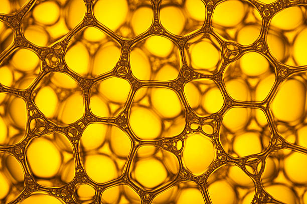 istock Yellow Soap Bubbles 6 - Water Abstract Macro Foam Background 527216618