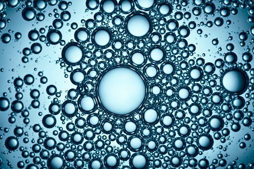 Macro photography of soap bubbles. Blue backlight.
