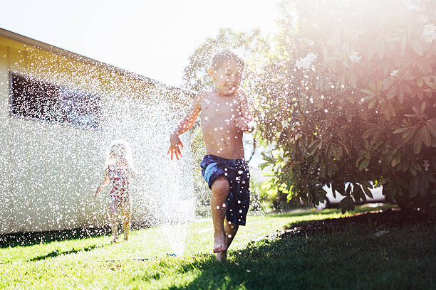 Boy spits water out of his mouth
