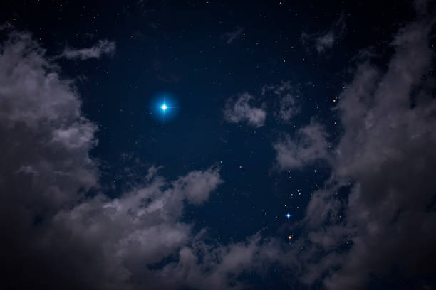 Stars visible among clouds stock photo