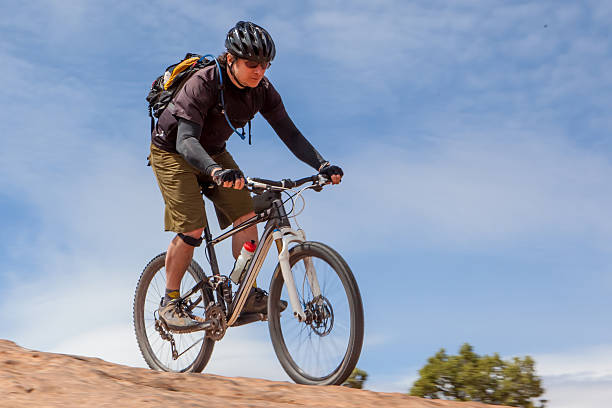 istock Mountain biker on a slickrock trail in Moab Utah. 527219302