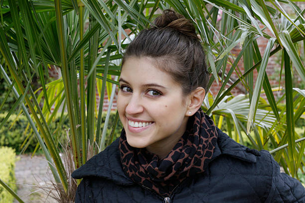 istock Smiling Russian outdoor girl with palm tree background 527220406