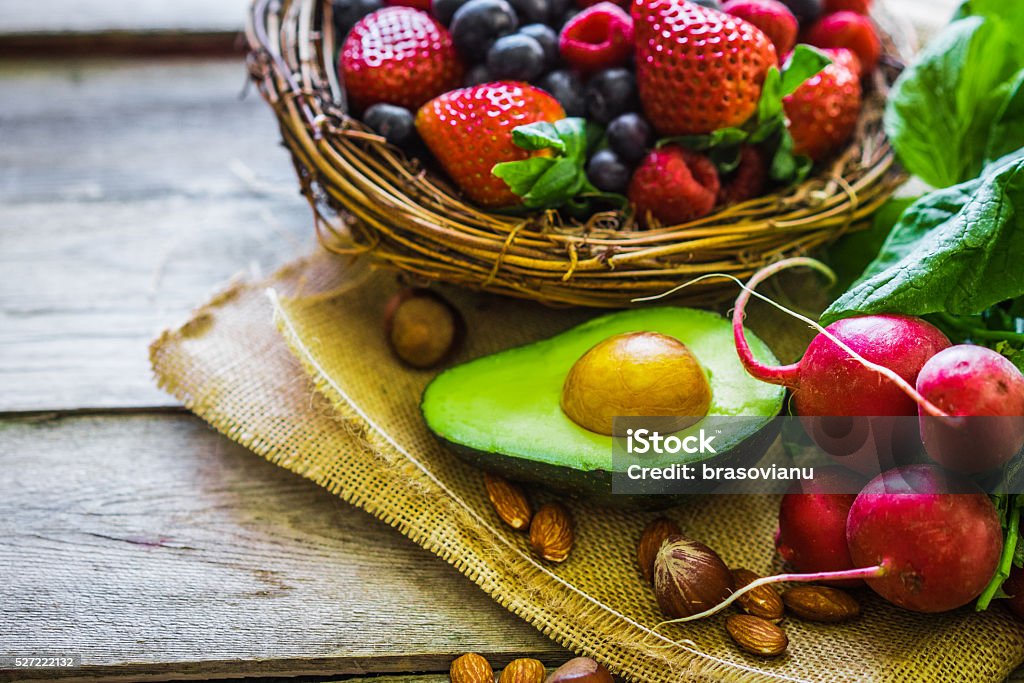 Fruits and vegetables on rustic background Avocado Stock Photo