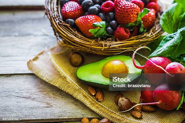 Fruits And Vegetables On Rustic Background Stock Photo - Download Image Now - Avocado, Basil, Blueberry