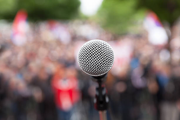 istock Political protest. Public demonstration. Microphone. 527224612