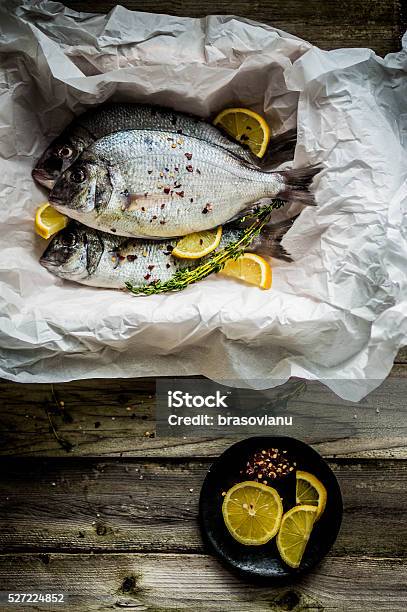 Fresh Sea Bream On Wooden Board Stock Photo - Download Image Now - Backgrounds, Close-up, Cooking