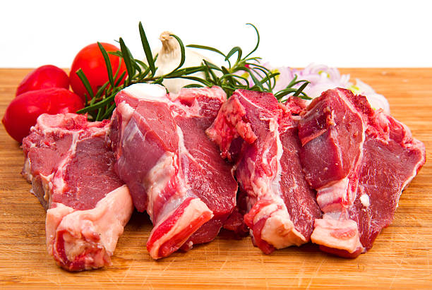 istock raw T-bone on wood background 527226118