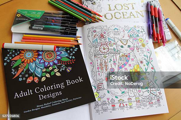 Adult Coloring Books And Variety Of Pencils Pens And Markers Stock