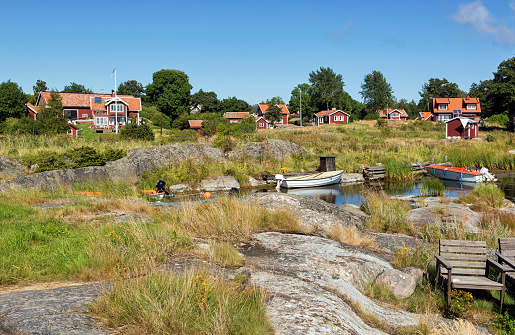 Archipelago village with typical red houses.