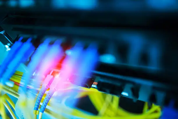 fiber optic with servers in a technology data center .