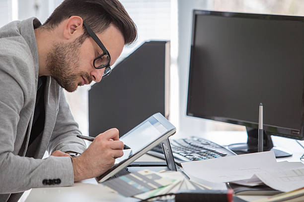 Young professional in creative office working on graphic tablet