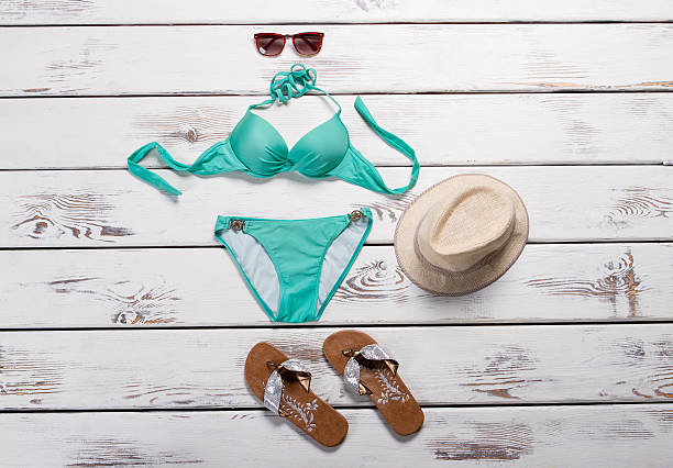 istock Turquoise swimsuit and aviator sunglasses. 527234730