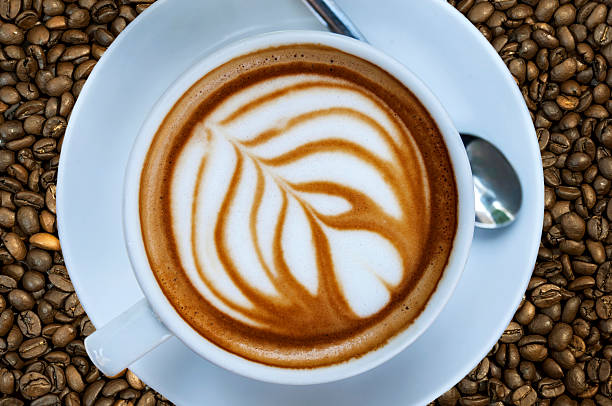 istock Cup of hot espresso drink on coffee bean background 527234854