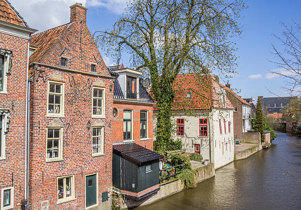 istock Old houses along a canal in Appingedam 527235484