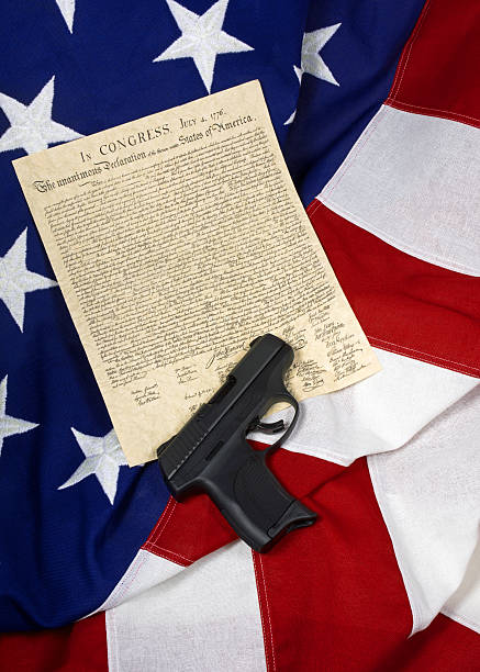 istock Declaration of Independence with Hand Gun 527236012