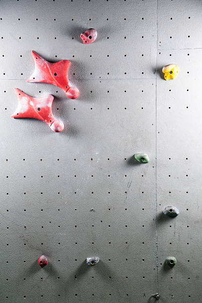 istock Artificial climbing wall with a variety of holds 527236080