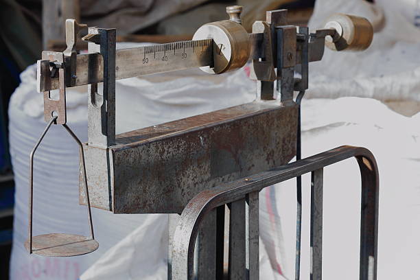 Old metallic platform scale showing its graduated beam placed among the sacks crowding a store of Mek'ele-Mekelle town at 2084 ms.high in Debubawi-Southern zone. Tigray region-Ethiopia.