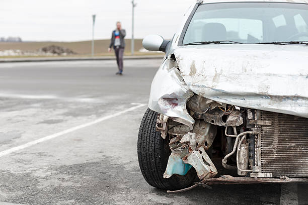 istock broken car after the accident in  foreground 527237828