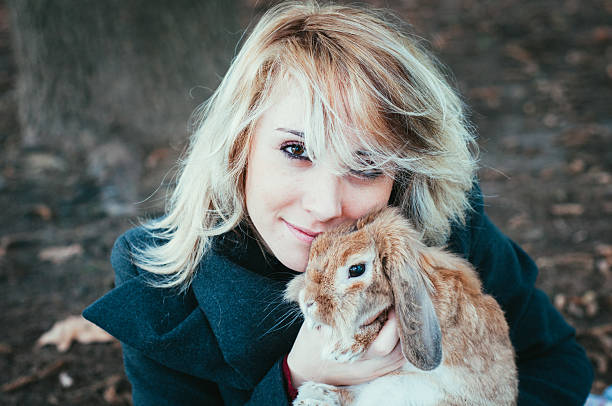 istock woman with rubbit, outdoor 527238488