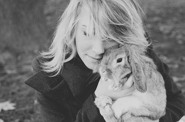 istock woman with rubbit, outdoor 527238662