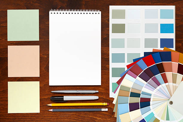 istock Color palette guide on the wooden background and notepad 527239506