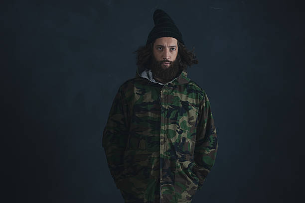 istock Vintage man with beard and long hair wearing camouflage jacket. 527241222