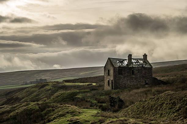 istock Ruined house on desolate moorland 527241242