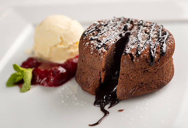 Lava cake with ice cream and mint leaves stock photo