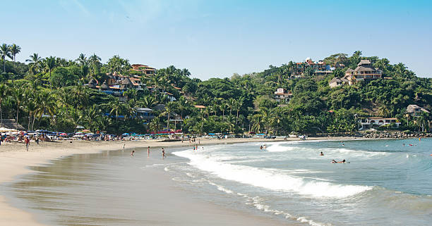 istock Salulita Beach and Surfers, Mexico 527273029