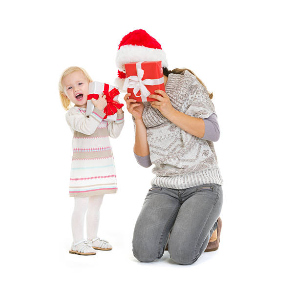 istock mother and baby playing with christmas present boxes 527273805