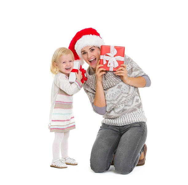 istock mother and baby peekaboo from christmas present boxes 527273807