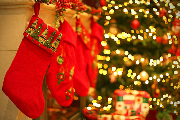 istock Red Christmas Stockings Hanging on a Fireplace Mantelpiece 527274859