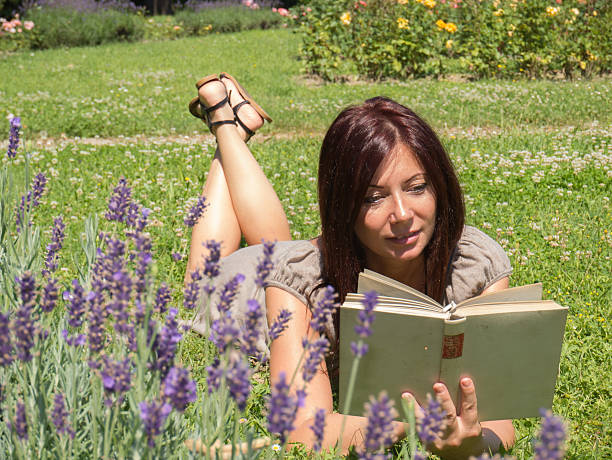 istock beautiful woman in the lavender fields 527275359