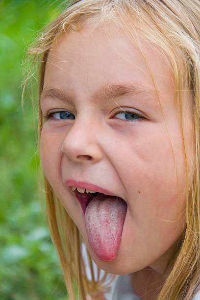 istock Cute girl with put out tongue 527275457