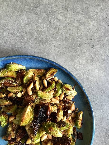 istock Oven roasted Brussels sprouts with pine nuts, garlic, Parmesan 527275635