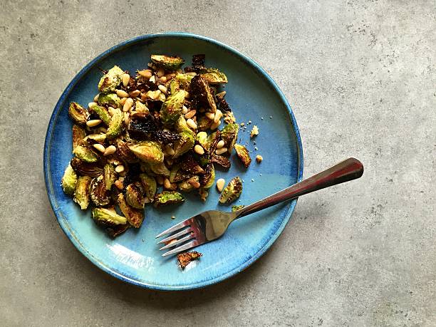 istock Oven roasted Brussels sprouts with pine nuts, garlic, Parmesan 527275641