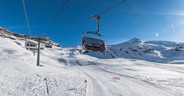 istock Chair lift and ski slope 527275663