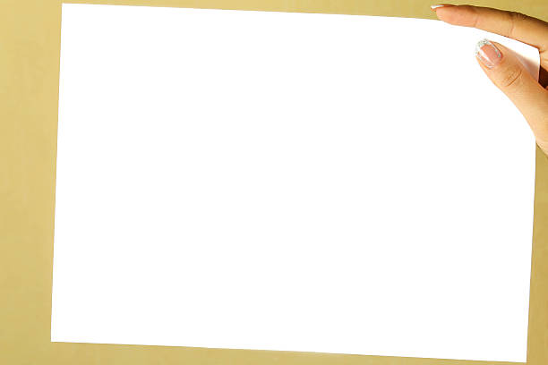 istock white sheet of paper in a female hand 527313657