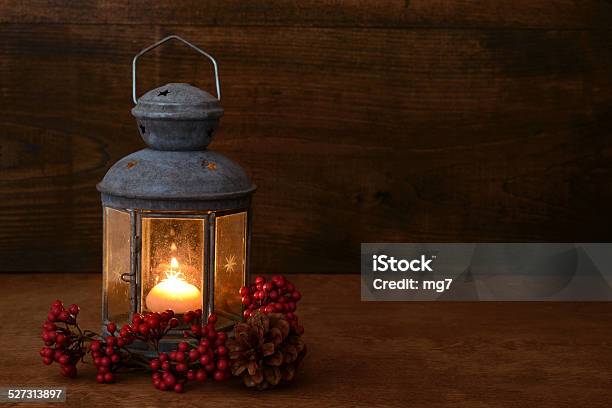 Antique Lantern With Red Berries Stock Photo - Download Image Now - Antique, Atmospheric Mood, Burning