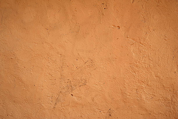 istock Texture of old wall covered with brown stucco 527314237