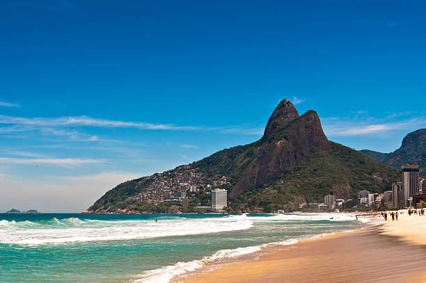 Ipanema Beach  on Sunny Summer Day Sunny Summer Day in Ipanema Beach, Rio de Janeiro, Brazil. two brothers mountain stock pictures, royalty-free photos & images