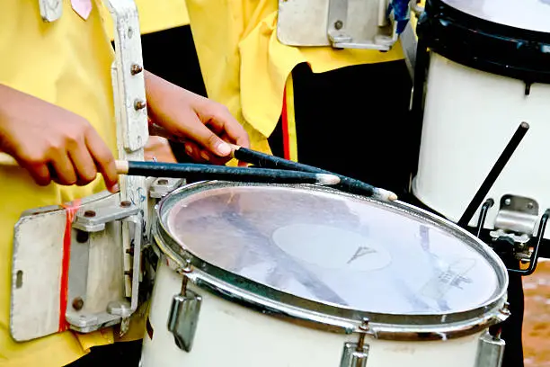 Drummers playing snare drums in parade