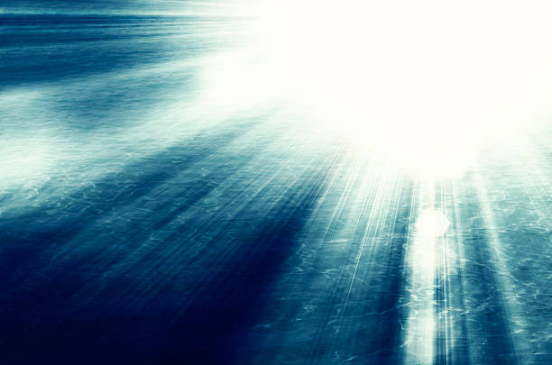 Sunburst rays over moody sea
