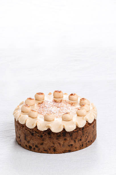 istock Simnel cake on a plate with marzipan on the top, 527318223
