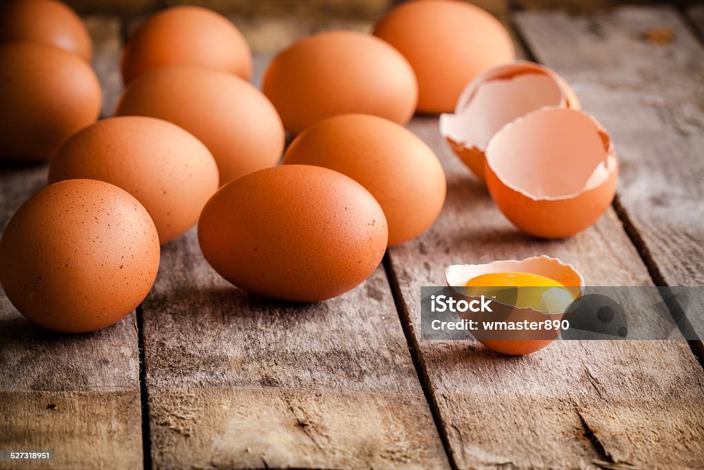 Fresh farm eggs Fresh farm eggs on a wooden rustic background Egg Yolk Stock Photo