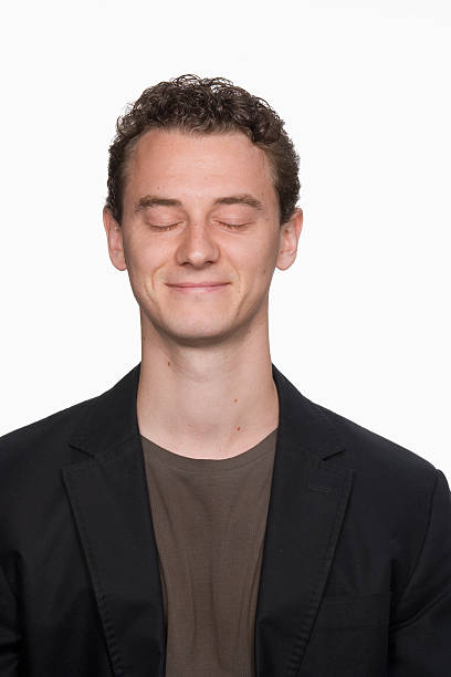 istock Man smiling with eyes closed, dreaming 527342839