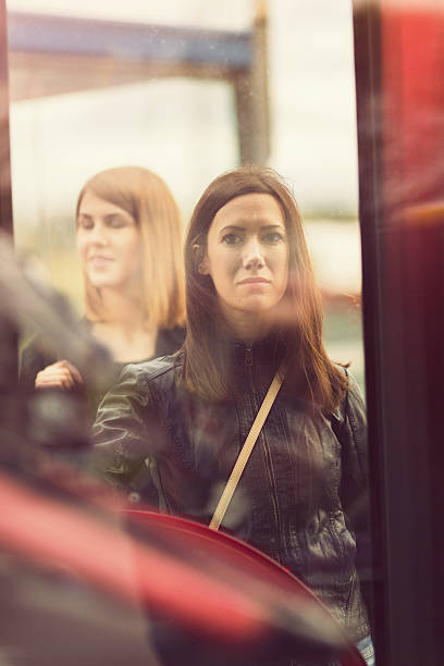 istock Young women waiting on the bus station 527343283