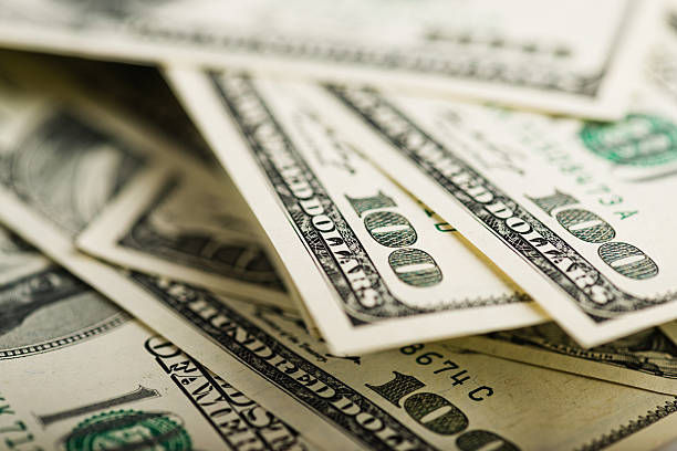 istock Stack of one hundred dollar bills close-up 527343555
